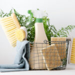 Eco brushes, sponges and rag in cleaning basket